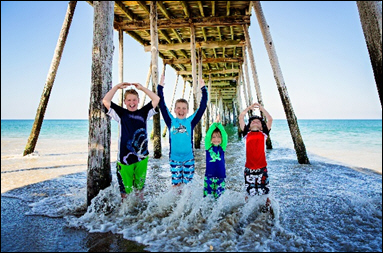 First prize in the Family and Friends Category went to Andrea and Bradford N. of Grove City, Ohio for a whimsical family beach photo.