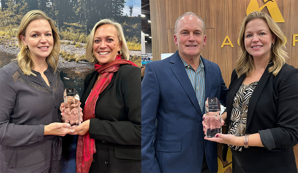 Next Level's Sarah Thompson Awards Bronwyn Slade, Director, Global Business Development at PDS, and Dion Kiernan, Regional Senior Sales Manager at Fairmont Banff Springs, as Partners of the Year.